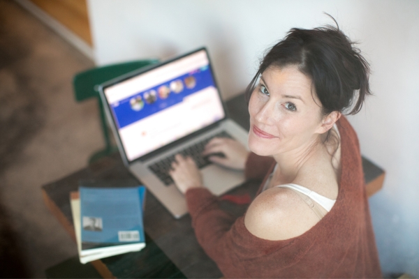 woman setting profile at dating site