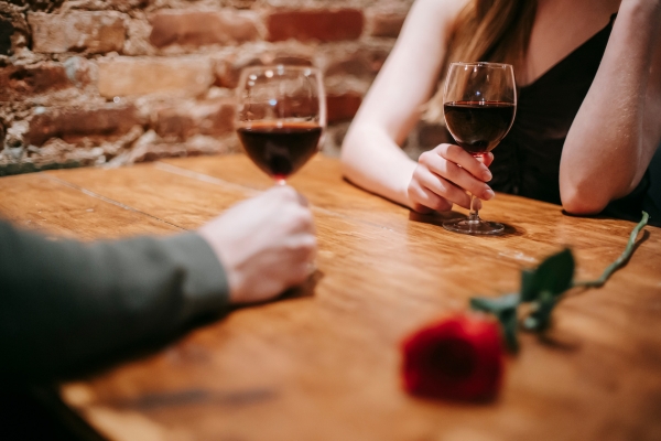 senior dating couple cafe wine and flower on table